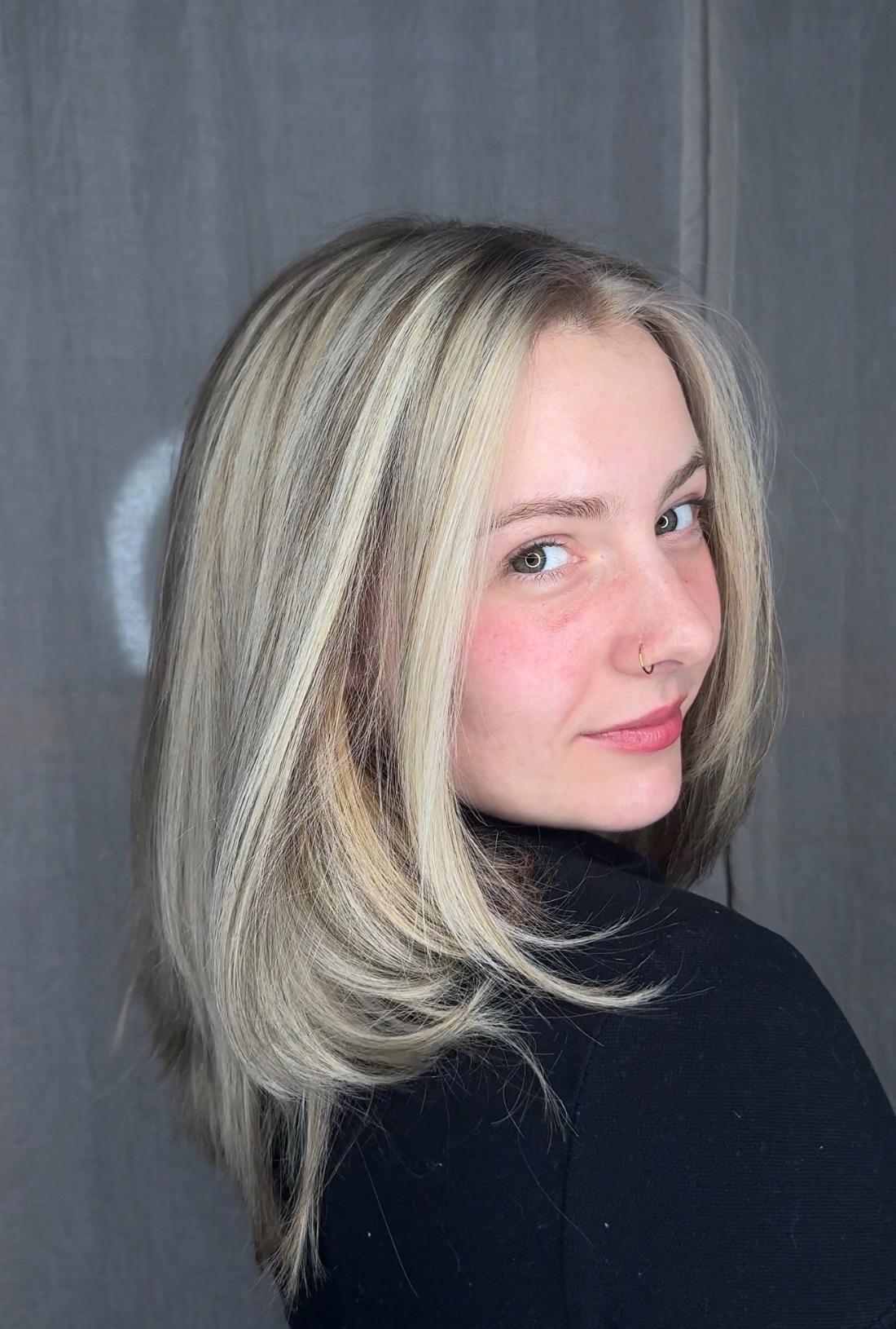 A blonde bob cut just below the jaw.